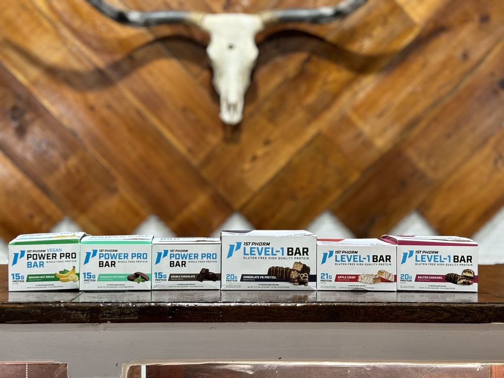 Renovated checkout wall with longhorn and chevron wood at Taylor Feed & Supply