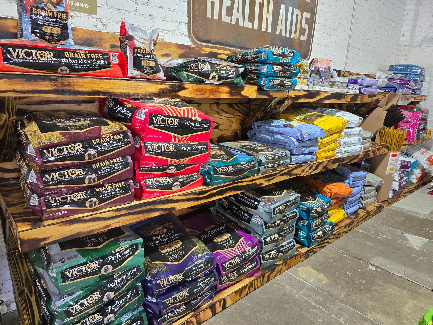 Victor pet food bags on wood shelves
