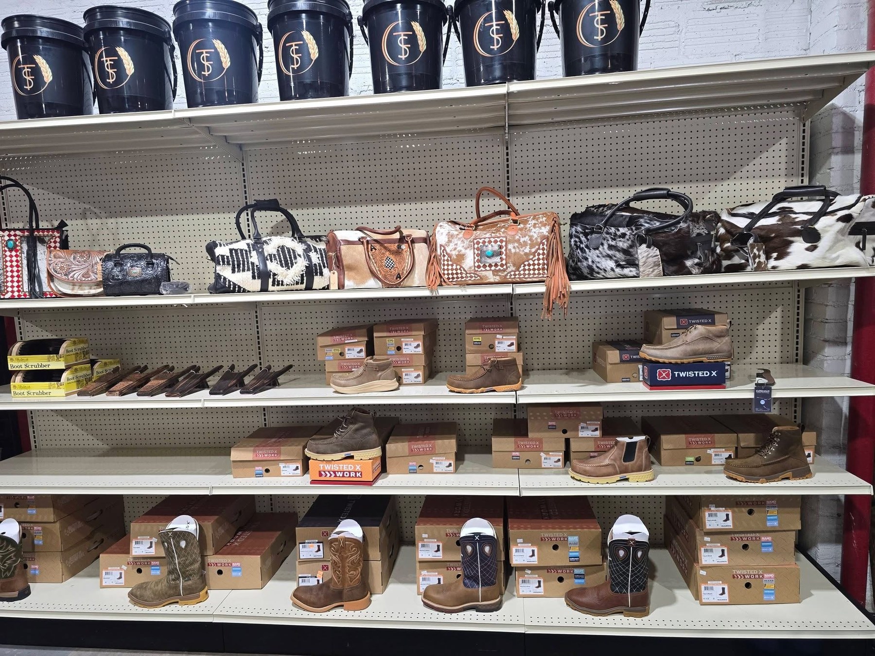 Twisted X boots, cowhide bags, and ranch gear on the shop shelves